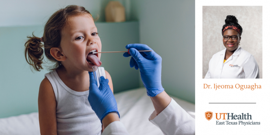 little girl getting her mouth examined